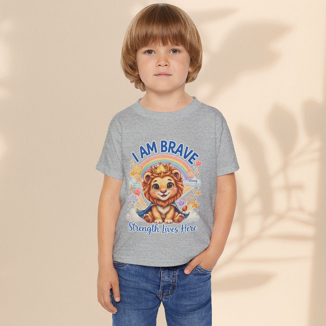 Child wearing a grey Sea Dragon Dreams cotton t-shirt featuring a Leo Lion graphic and I Am Brave text