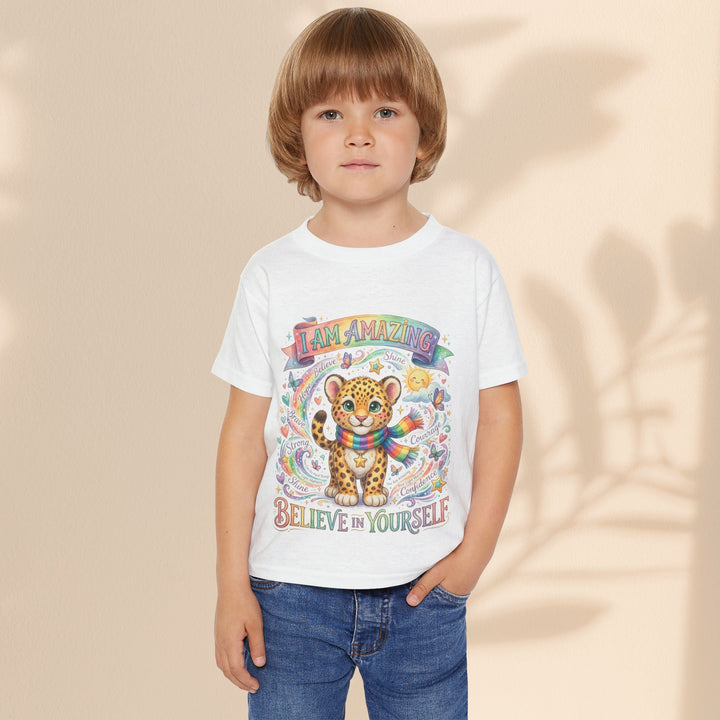 Sea Dragon Dreams toddler t-shirt featuring a cute leopard with a rainbow scarf and I Am Amazing affirmation graphic