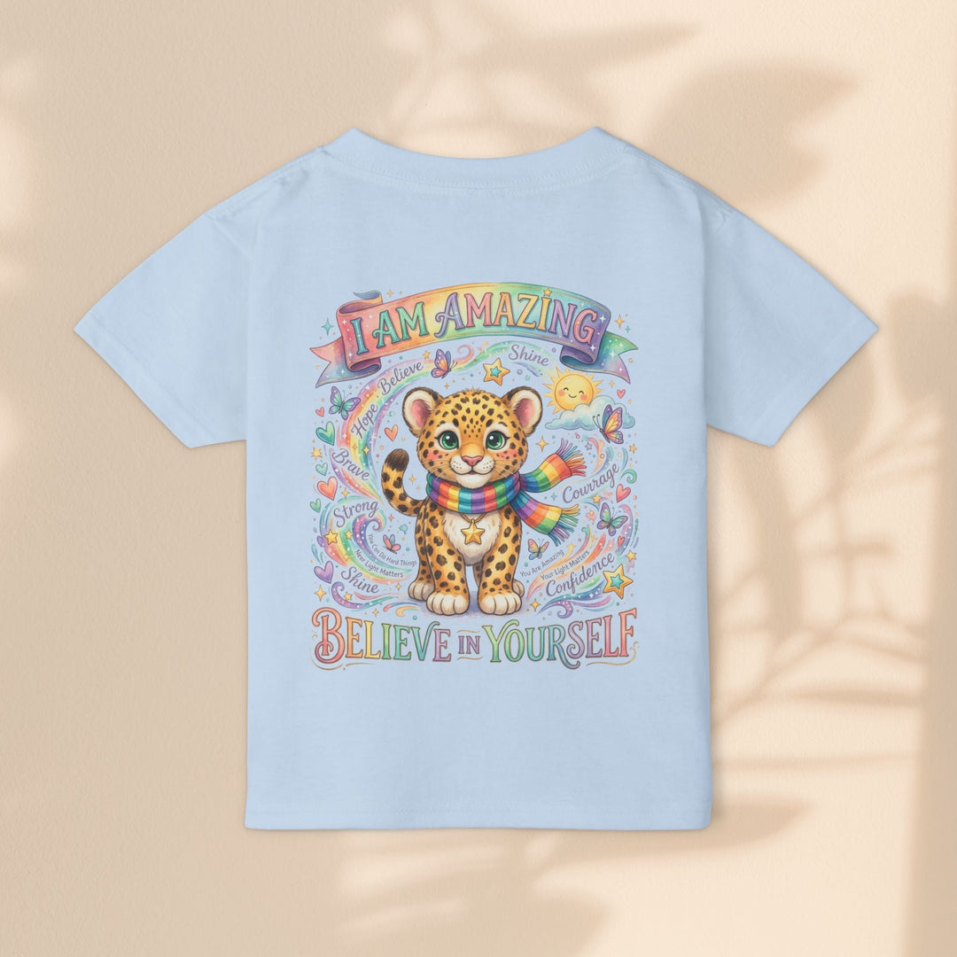 Sea Dragon Dreams light blue cotton toddler t-shirt featuring a cute leopard, rainbow scarf, and uplifting text.