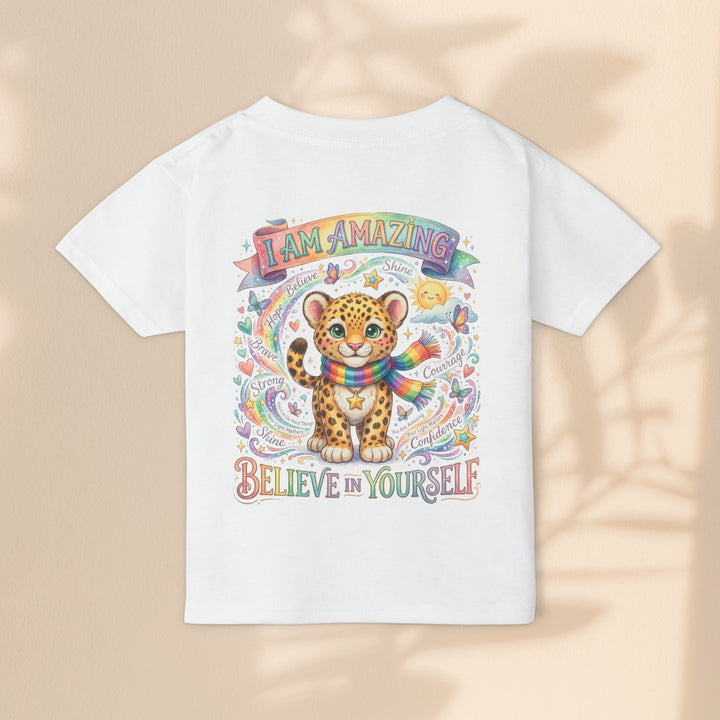 Sea Dragon Dreams white cotton toddler t-shirt featuring a cute leopard, rainbow scarf, and empowering affirmations.