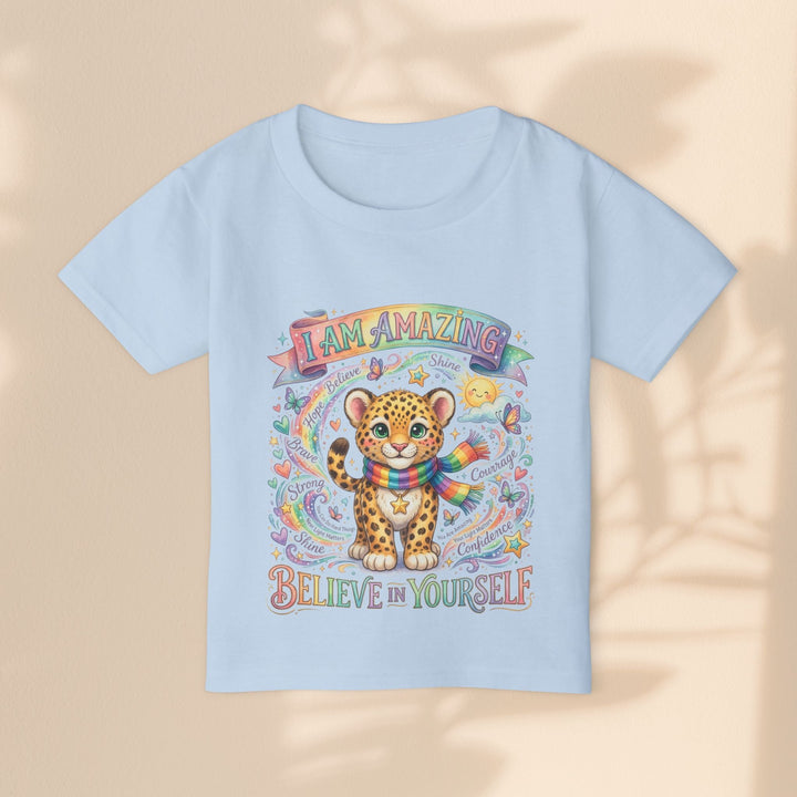 Sea Dragon Dreams light blue cotton toddler t-shirt with a cute leopard, rainbow scarf, and empowering affirmations.
