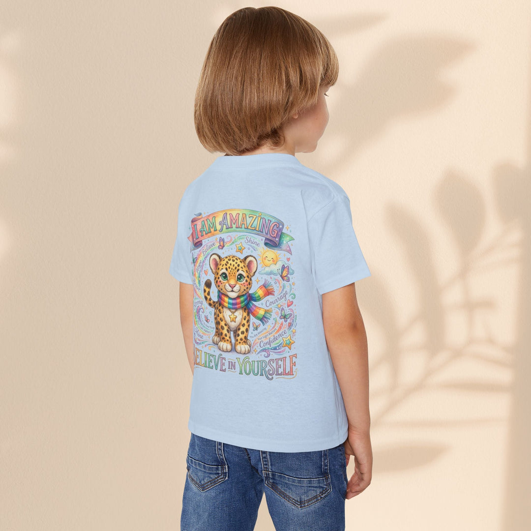 Sea Dragon Dreams toddler t-shirt in light blue cotton featuring a cute leopard, rainbow, and empowering text.