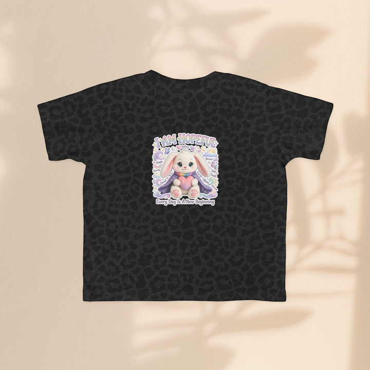 Sea Dragon Dreams toddler tee in black leopard print featuring a Hope Bunny graphic with the text I Am Hopeful.