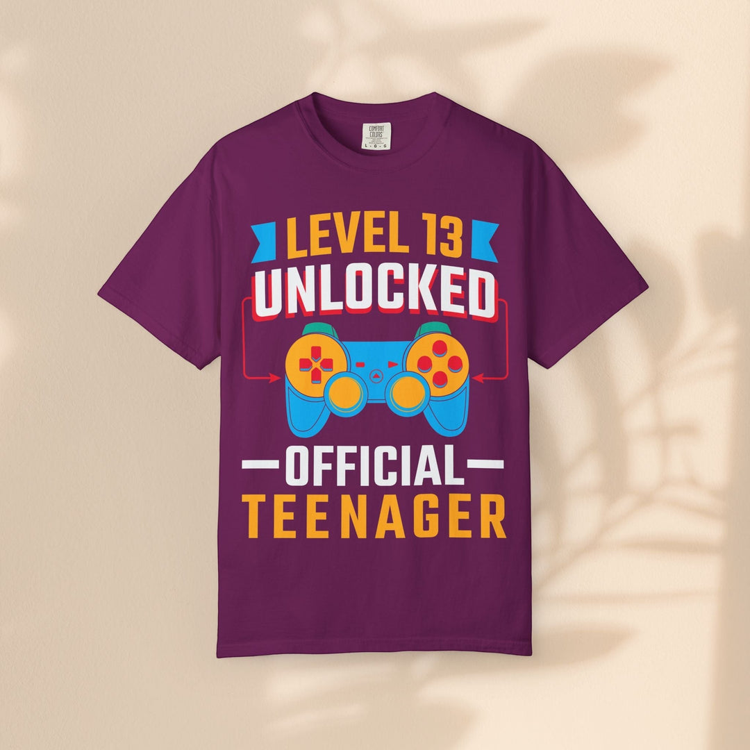 Sea Dragon Dreams Level 13 Unlocked gamer t-shirt in purple with a retro controller graphic for teen birthdays.
