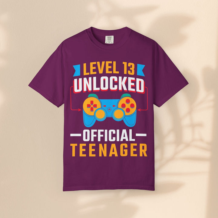 Sea Dragon Dreams Level 13 Unlocked gamer t-shirt in purple with a retro controller graphic for teen birthdays.