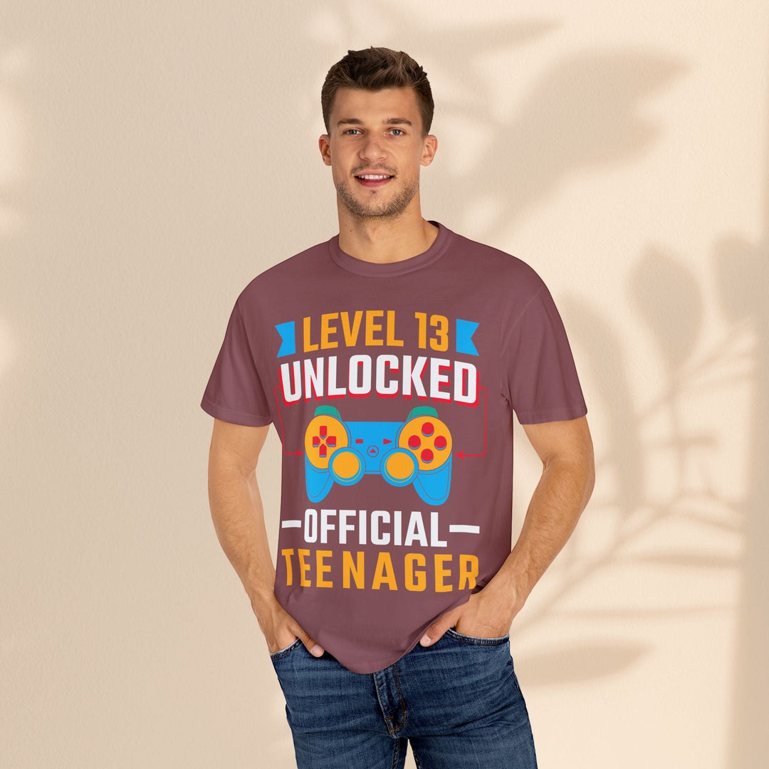 Sea Dragon Dreams unisex gamer t-shirt in maroon cotton with Level 13 Unlocked graphic worn by a smiling man