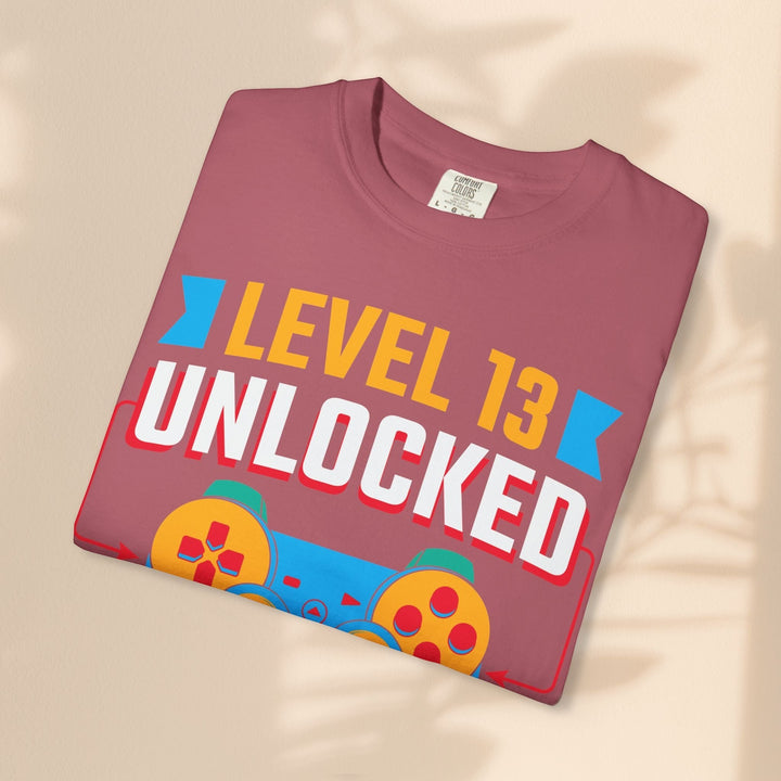 Sea Dragon Dreams Level 13 Unlocked gamer t-shirt in mauve cotton with a retro gaming controller graphic print.