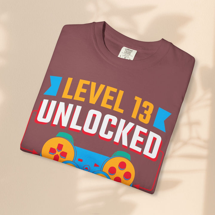 Sea Dragon Dreams Level 13 Unlocked gamer t-shirt in maroon cotton with a retro gaming controller graphic print.
