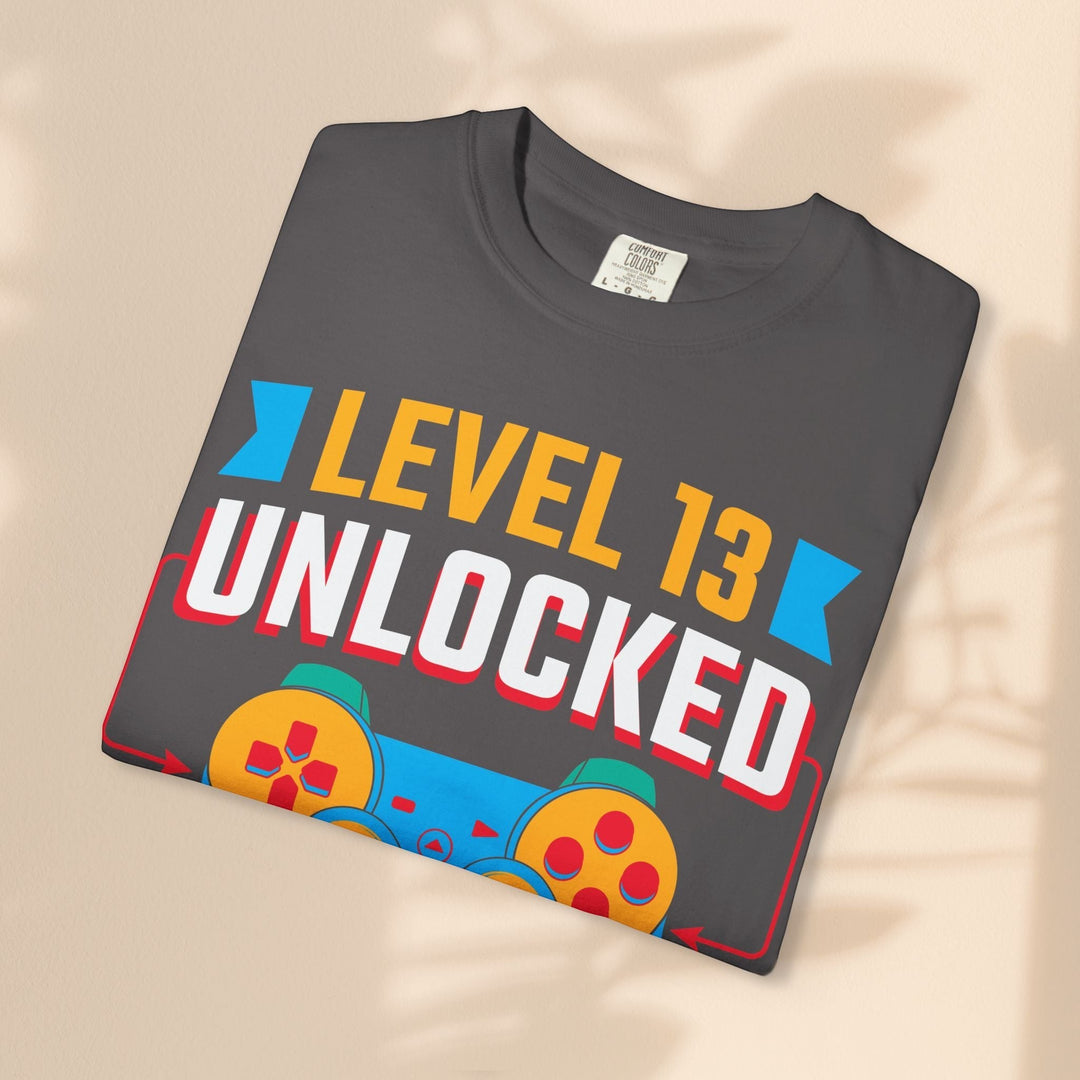 Sea Dragon Dreams Level 13 Unlocked gamer t-shirt in charcoal grey cotton with a retro blue and red controller graphic