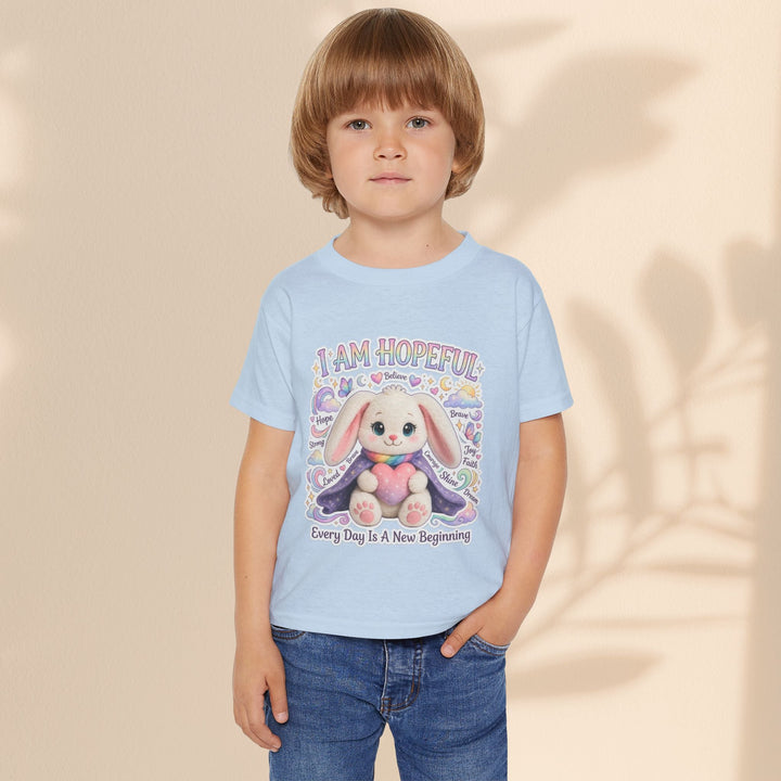 Sea Dragon Dreams toddler t-shirt in light blue cotton featuring a cute bunny graphic and I Am Hopeful text.