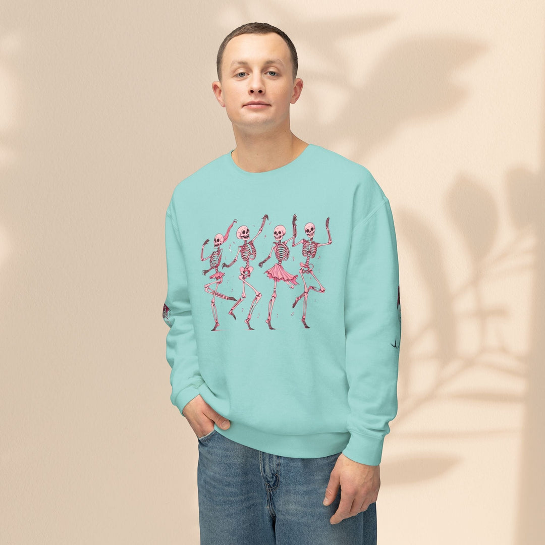 Man wearing a Sea Dragon Dreams light blue crewneck sweatshirt with a pink dancing skeletons graphic print.