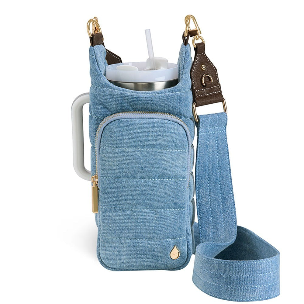 Sea Dragon Dreams HydroBag light denim water bottle carrier with quilted fabric, gold hardware, and adjustable strap.