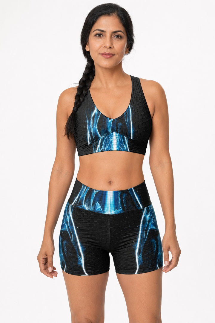 Sea Dragon Dreams sports bra and high-waisted shorts set with a black and blue electric lightning pattern
