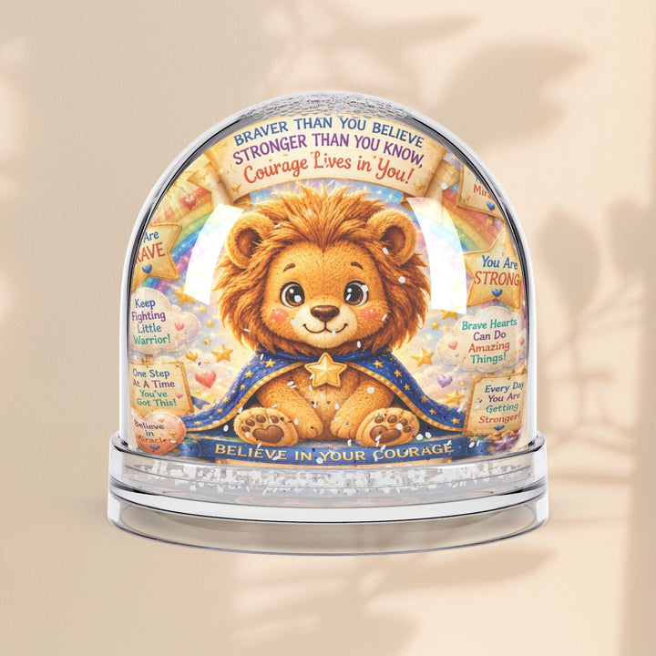Sea Dragon Dreams Brave Buddies lion snow globe with inspirational text and glitter, featuring a cute lion character.