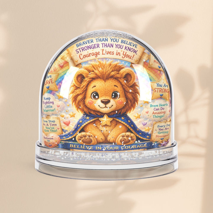 Sea Dragon Dreams snow globe featuring a cute lion illustration with inspirational messages about courage and strength.
