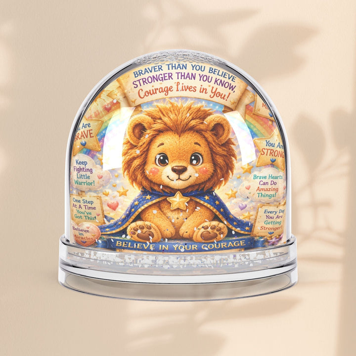 Sea Dragon Dreams Leo Lion snow globe with inspirational quotes and glitter, featuring a brave lion in a blue cape.