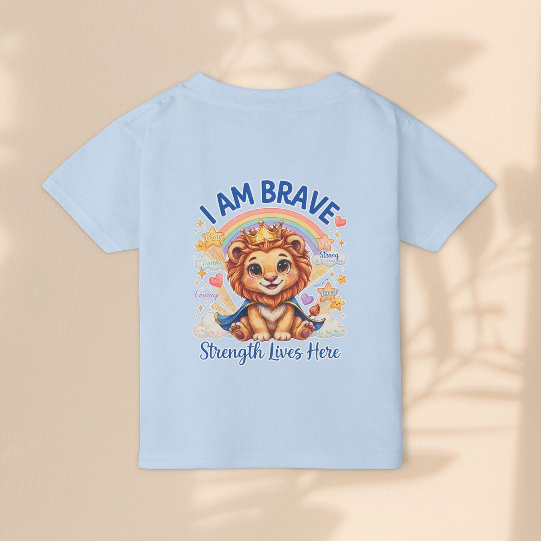 Sea Dragon Dreams light blue toddler t-shirt featuring a cute lion wearing a crown with the text I Am Brave