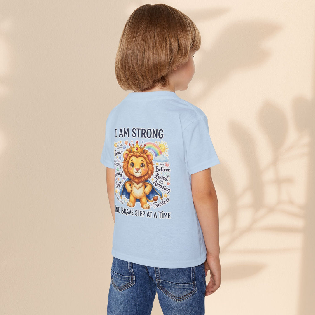 Sea Dragon Dreams toddler t-shirt in light blue cotton featuring a lion graphic with the text I Am Strong