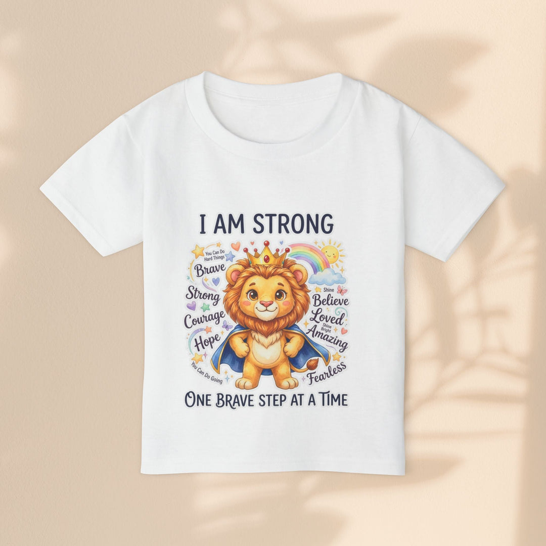 Sea Dragon Dreams white cotton toddler t-shirt featuring a cute lion wearing a crown and cape with empowering text.