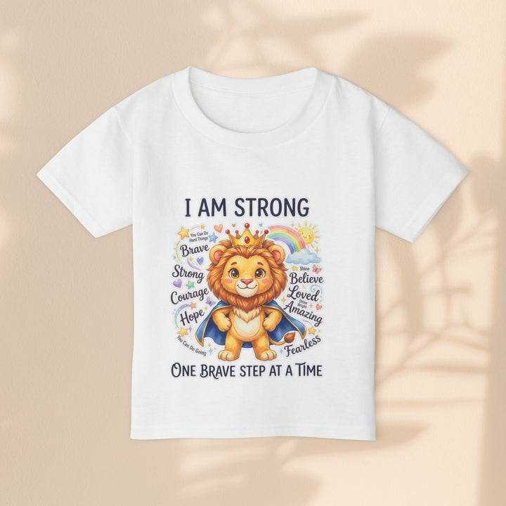 Sea Dragon Dreams white cotton toddler t-shirt featuring a cute lion wearing a crown and cape with empowering text.