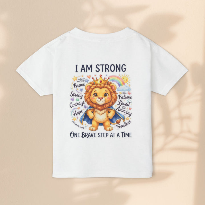 Sea Dragon Dreams white cotton toddler t-shirt featuring a courageous lion graphic with the text I Am Strong