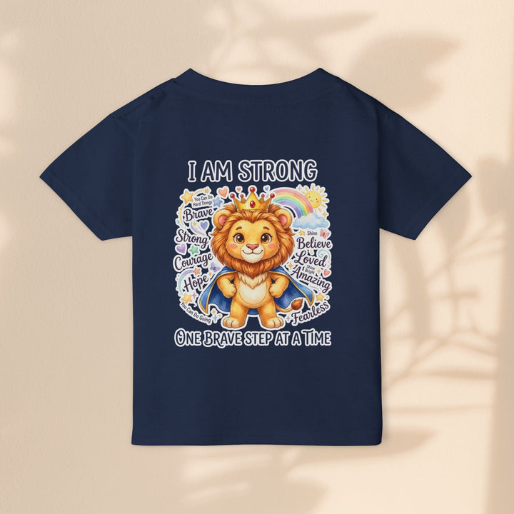 Sea Dragon Dreams toddler t-shirt in navy blue featuring a lion graphic with the text I Am Strong and inspirational words.