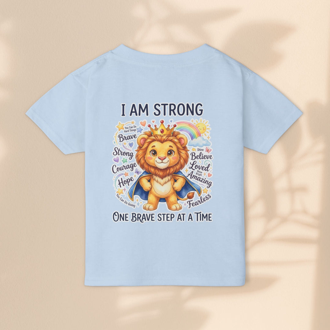 Sea Dragon Dreams toddler t-shirt in light blue cotton featuring a courageous lion graphic and I Am Strong text