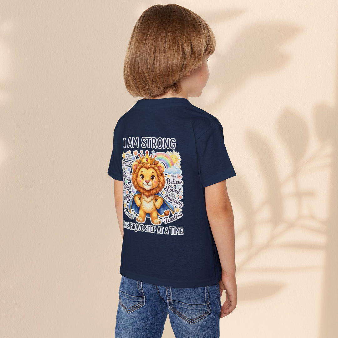 Sea Dragon Dreams navy toddler t-shirt with a courageous lion graphic and I Am Strong affirmation on the back