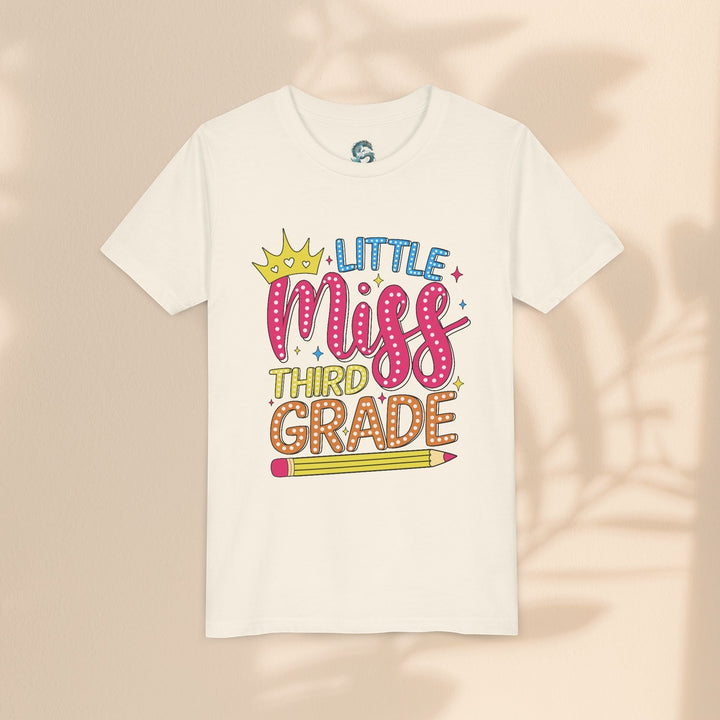 Sea Dragon Dreams Little Miss Third Grade youth t-shirt in cream cotton with a colorful back-to-school graphic.