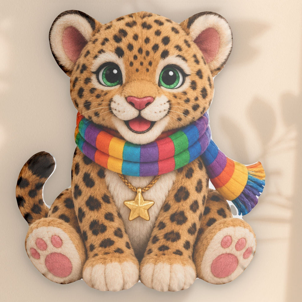 Sea Dragon Dreams Brave Buddies Lucky Leopard pillow with a rainbow scarf and gold star charm on a beige background.