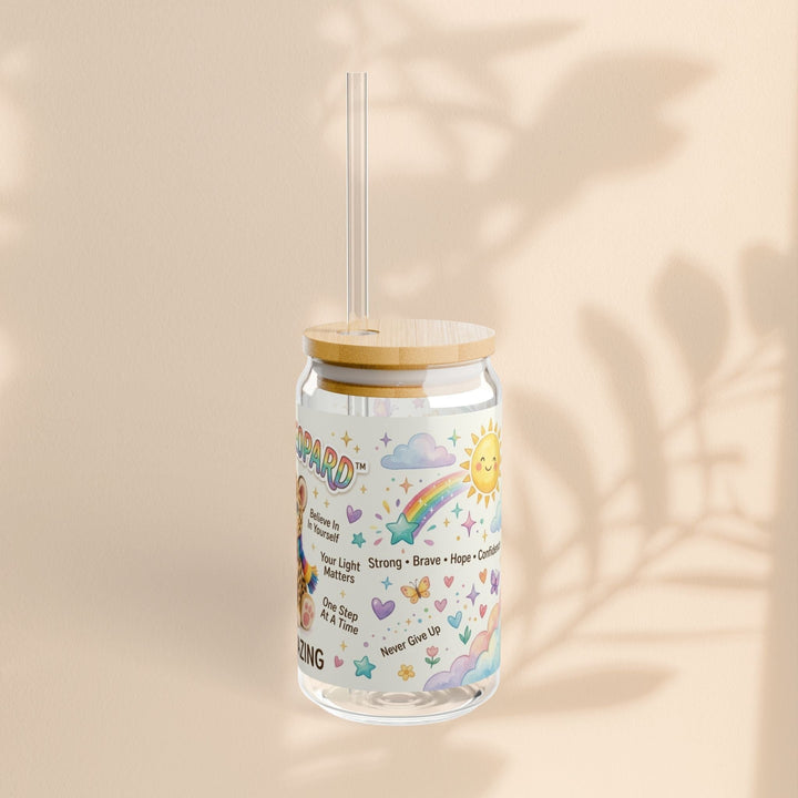 Sea Dragon Dreams Lucky Leopard 16oz glass sipper with bamboo lid, clear straw, and colorful rainbow affirmation art.