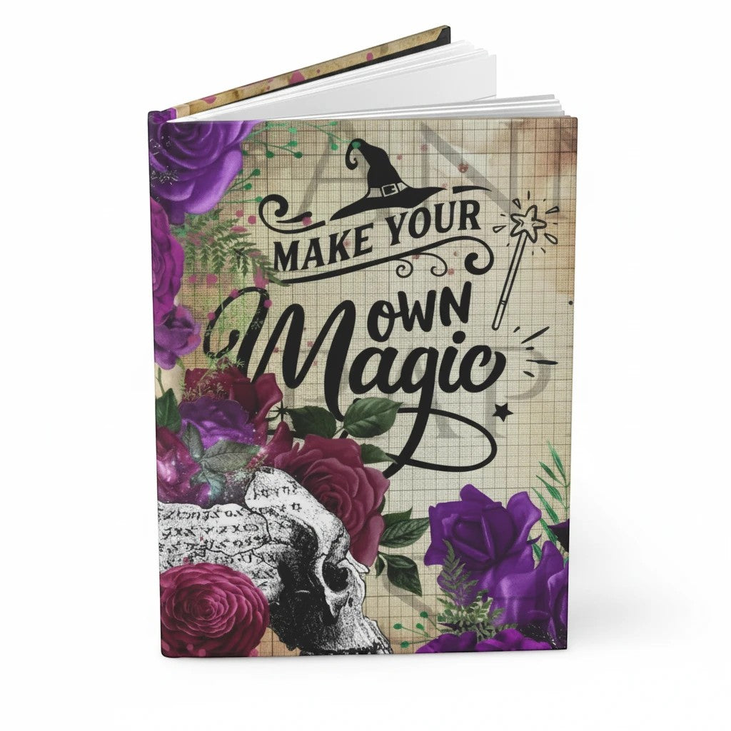 Sea Dragon Dreams hardcover journal with Make Your Own Magic typography, purple roses, and skull on a grid background.