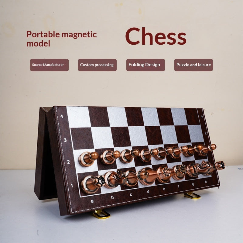 Sea Dragon Dreams portable magnetic chess set with a folding brown and silver board and metallic chess pieces