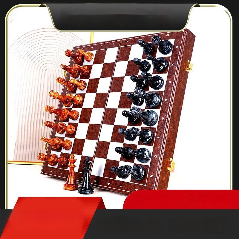 Sea Dragon Dreams portable magnetic chess set with brown and black pieces on a folding wooden board for travel