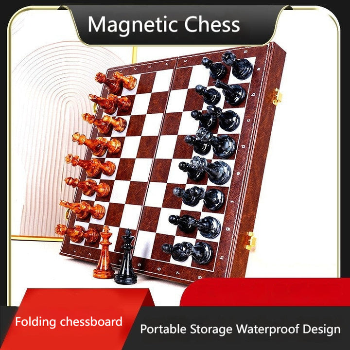 Sea Dragon Dreams portable magnetic chess set with a folding wooden-style board and black and amber chess pieces.