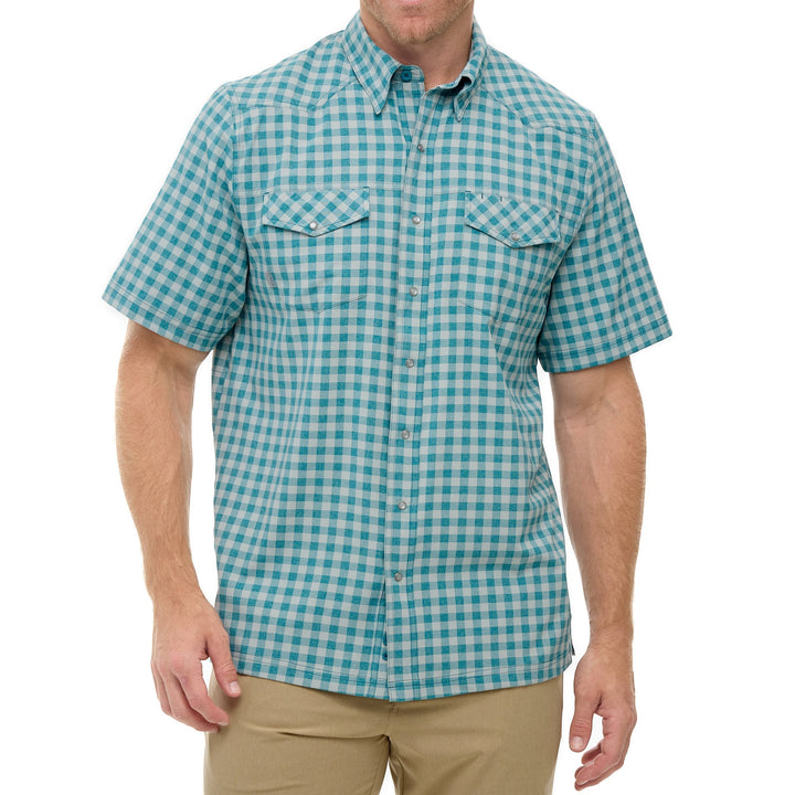 Sea Dragon Dreams Mahi Pearl Snap Shirt in teal and white plaid with chest pockets and short sleeves on a model.