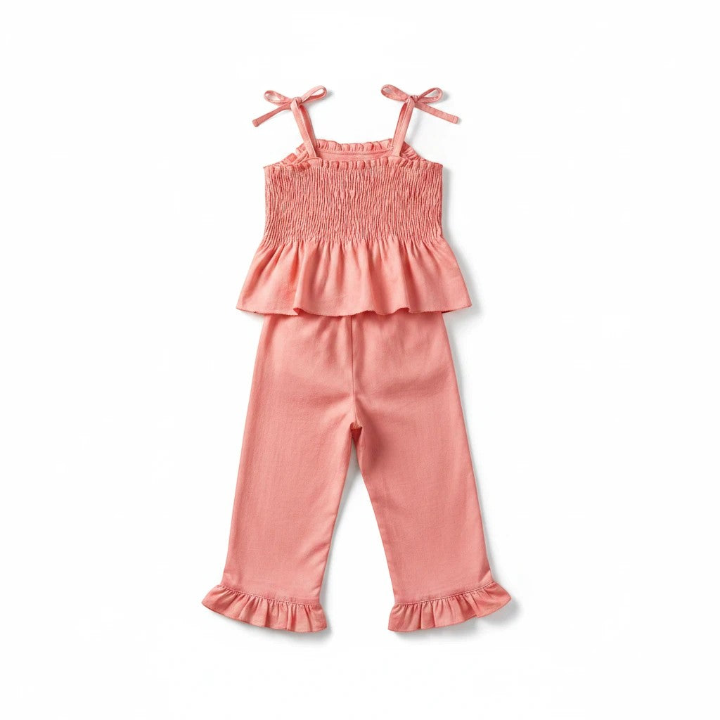 Sea Dragon Dreams Maisie smocked two-piece set in pressed peony pink with ruffled hem and tie-shoulder straps.