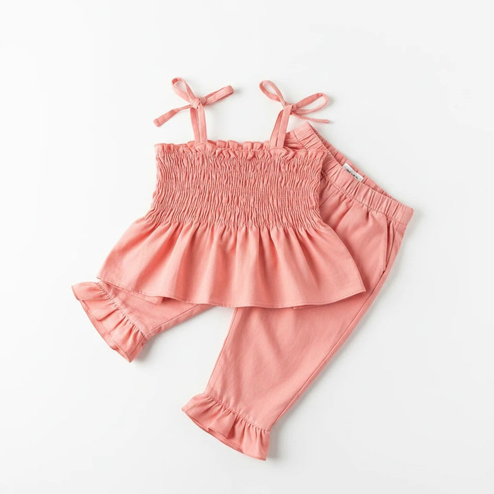 Sea Dragon Dreams Maisie smocked two-piece set in pressed peony pink with ruffled hem and tie straps