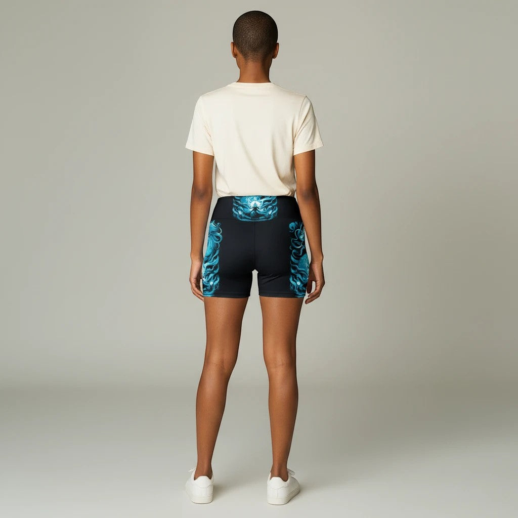 Back view of a model wearing Sea Dragon Dreams Majestic Reign workout shorts with a blue printed design.