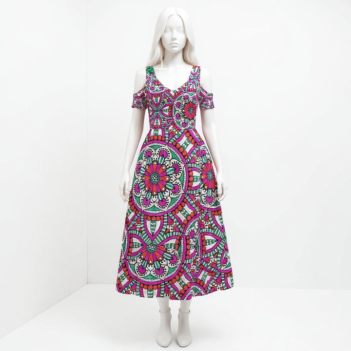 Sea Dragon Dreams off-shoulder maxi dress with a vibrant pink and green circular mandala pattern on a white mannequin