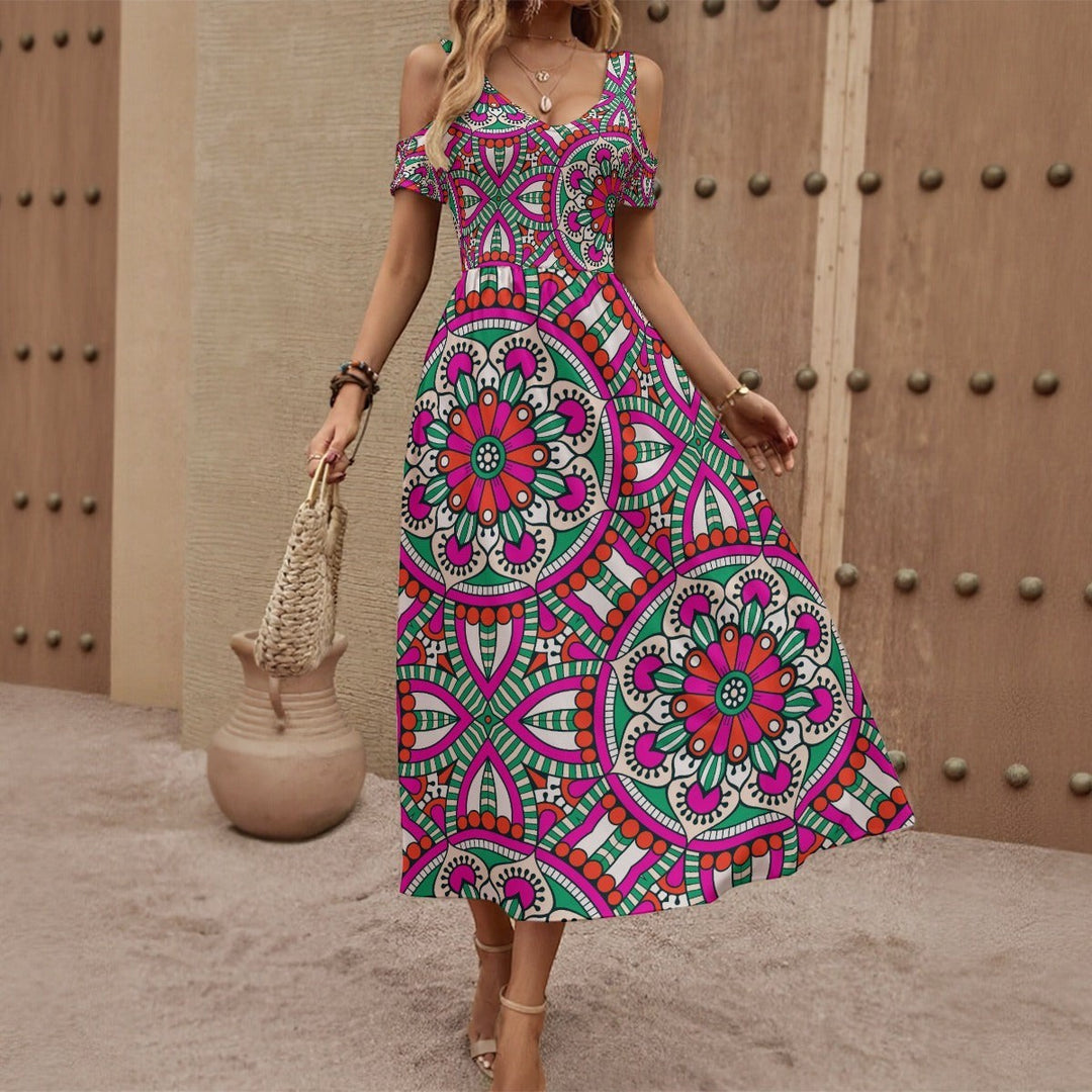 Sea Dragon Dreams off-shoulder maxi dress featuring a vibrant pink, green, and white circular mandala pattern.
