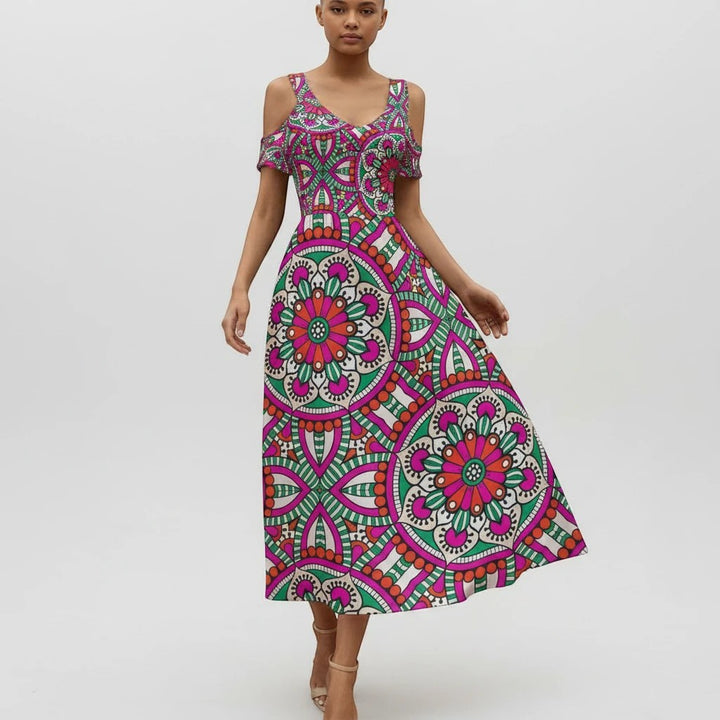 Sea Dragon Dreams off-shoulder maxi dress featuring a vibrant pink, green, and white circular mandala pattern.