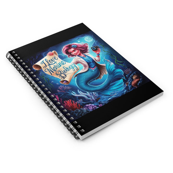 Sea Dragon Dreams spiral notebook featuring a mermaid marine biologist illustration on an ocean-themed cover.