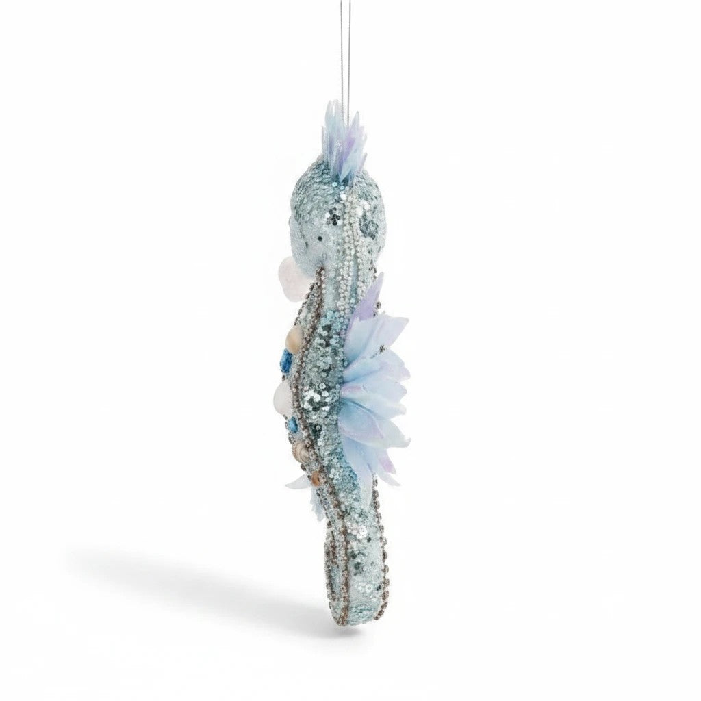 Sea Dragon Dreams Mark Roberts blue seahorse ornament with iridescent fins, glitter, sequins, beads, and sea shells.