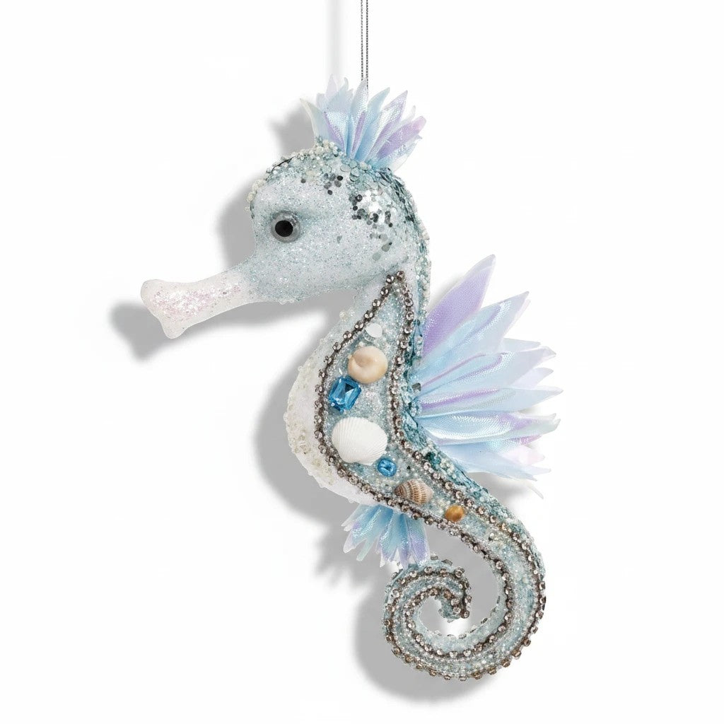 Sea Dragon Dreams Mark Roberts blue seahorse ornament decorated with glitter, sequins, beads, gems, and seashells.