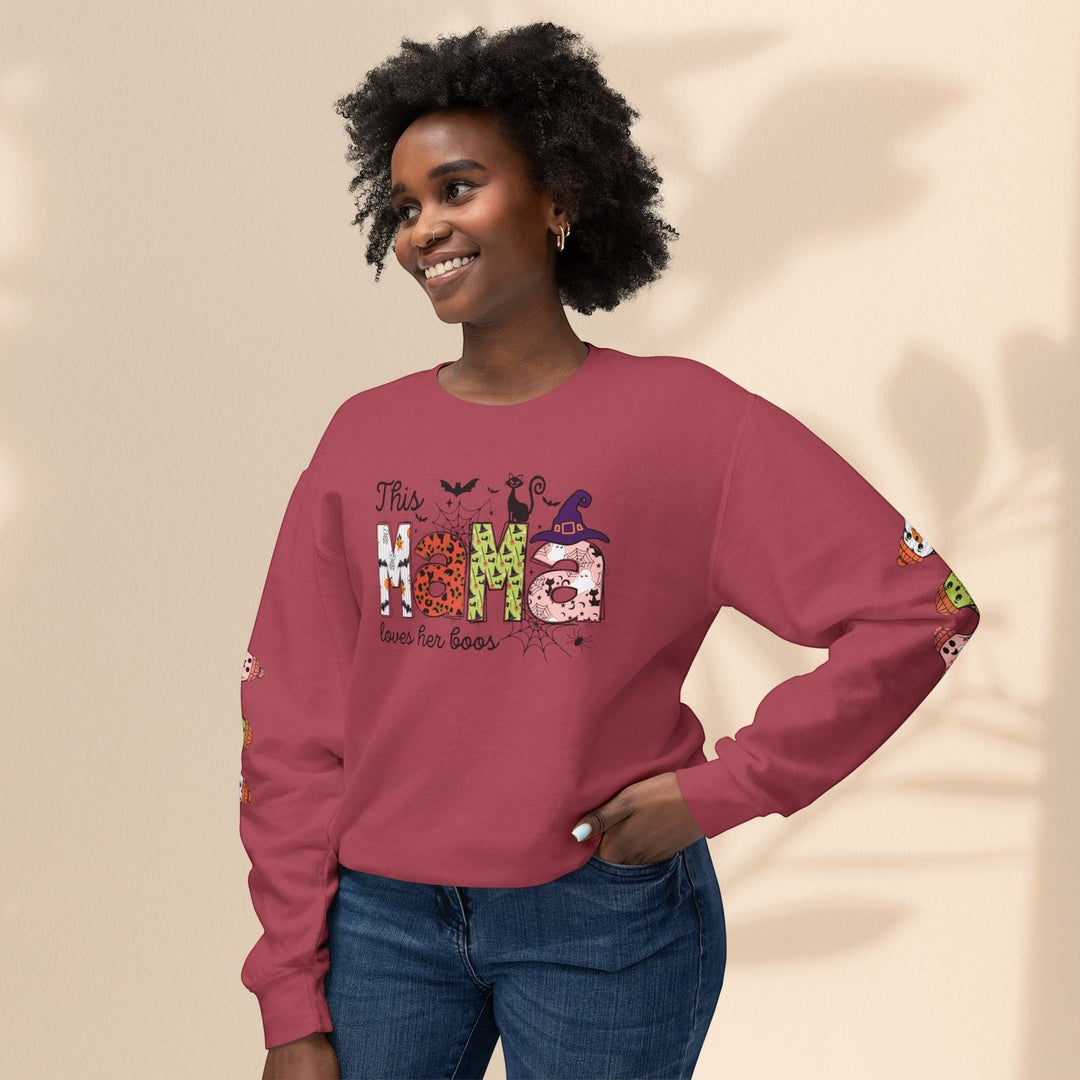 Sea Dragon Dreams crewneck sweatshirt in maroon with This Mama Loves Her Boos Halloween graphic and sleeve print.