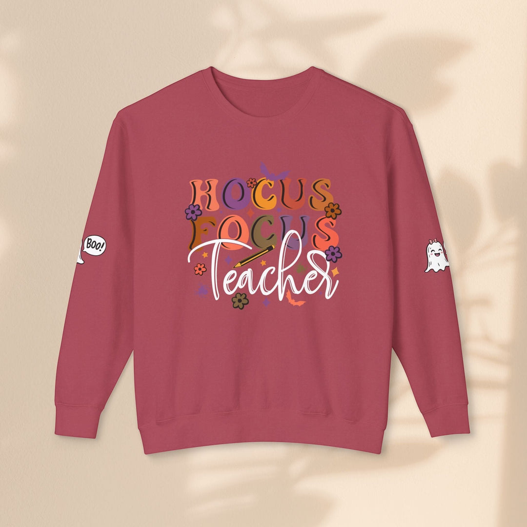 Sea Dragon Dreams Hocus Focus Teacher crewneck sweatshirt in maroon with ghost and floral graphic print on sleeves.