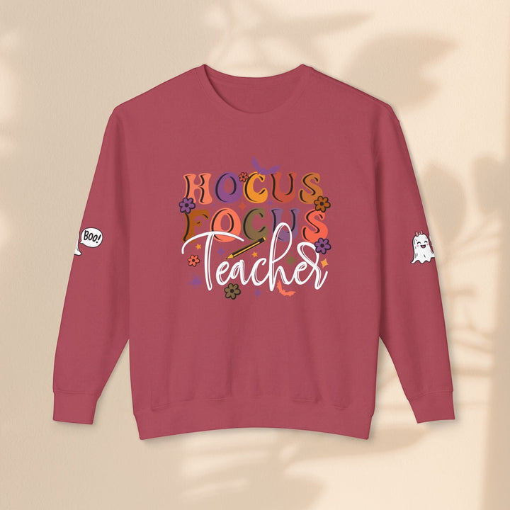 Sea Dragon Dreams Hocus Focus Teacher crewneck sweatshirt in maroon with ghost and floral graphic print on sleeves.