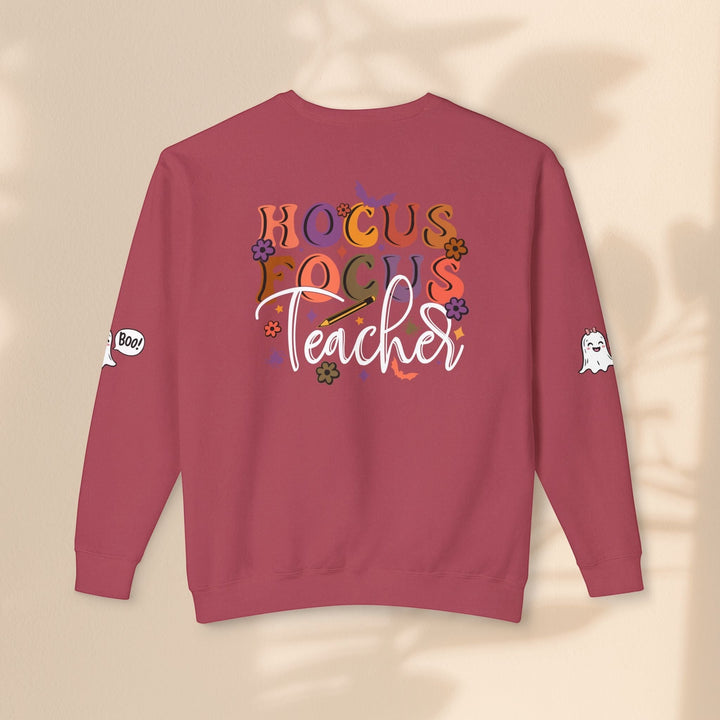 Sea Dragon Dreams maroon crewneck sweatshirt with Hocus Focus Teacher graphic, ghost icons, and floral details.