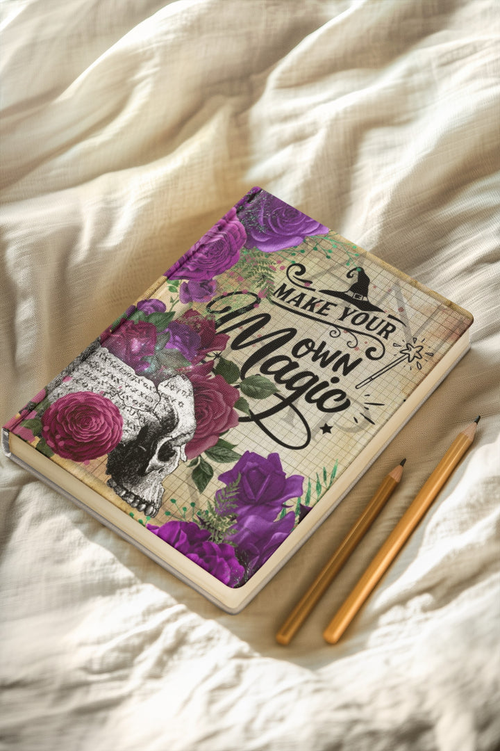 Sea Dragon Dreams hardcover journal with purple roses, skull, and Make Your Own Magic typography on a soft fabric.